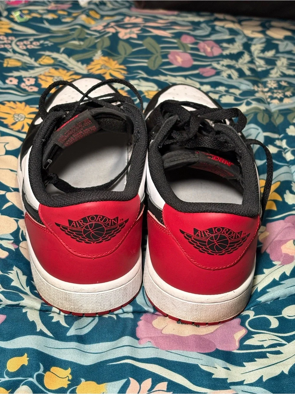 Jordan 1 Low Black and White Sneakers with Red Logo Accent